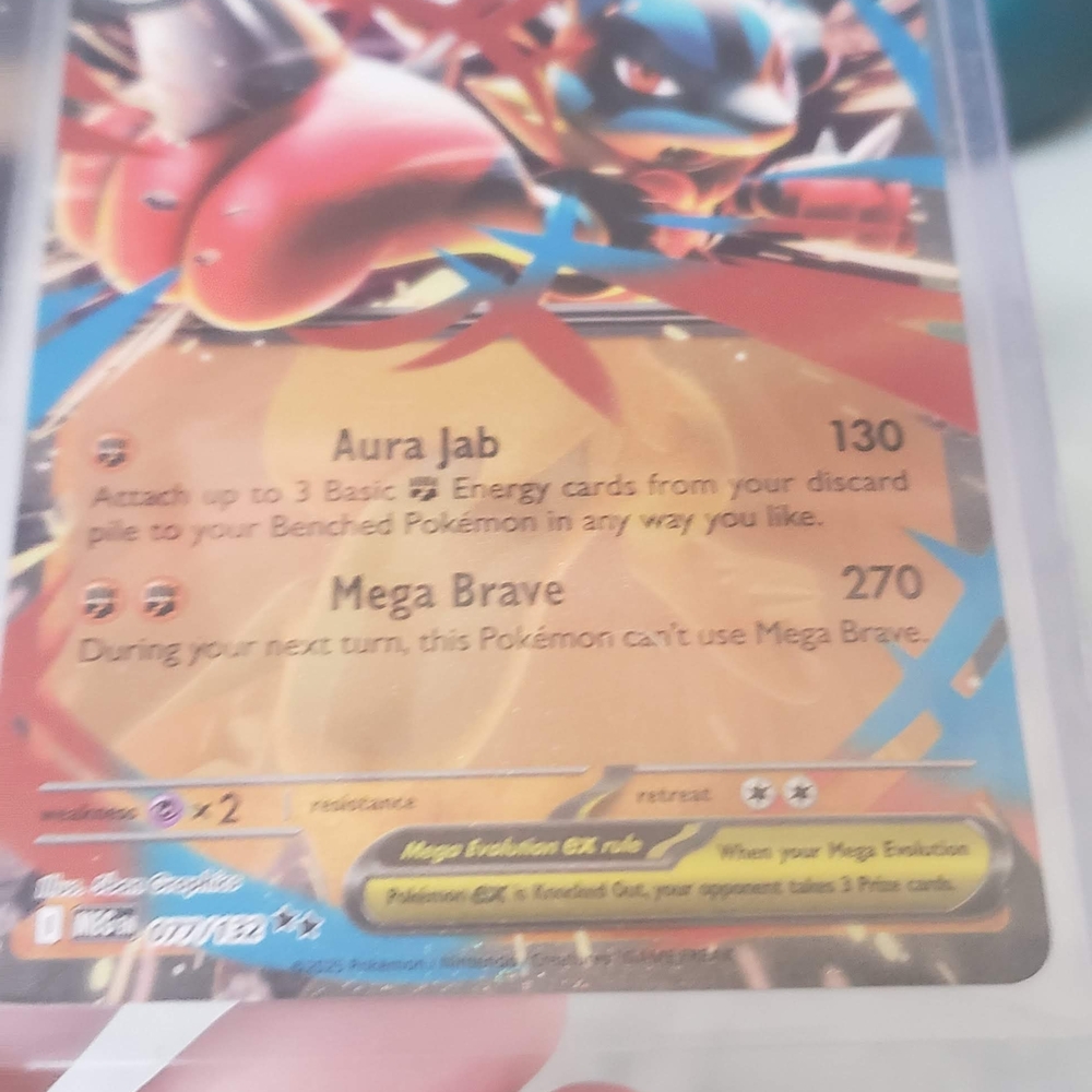 Pokemon Trading Card with Aura Jab and Mega Brave